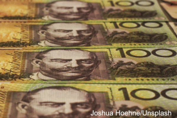 Rows of Australian $100 notes. Photo by Joshua Hoehne, Unsplash.